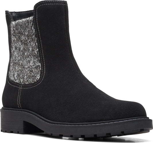Black, ankle-high Chelsea boot with a gray, knit panel and a chunky sole.