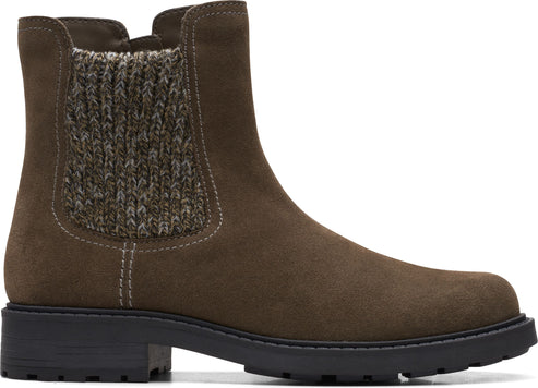 Dark brown suede ankle boot with knit side panels and black lug sole.