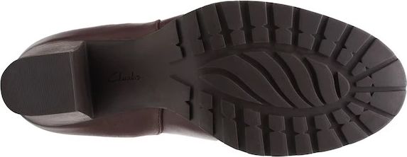 Brown boot outsole with tread.