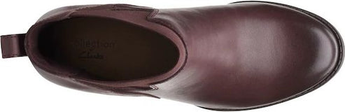 A maroon colored boot shown from above.