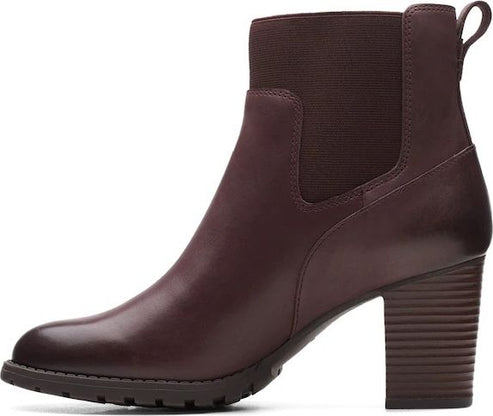 Burgundy heeled ankle boot with elastic panels.