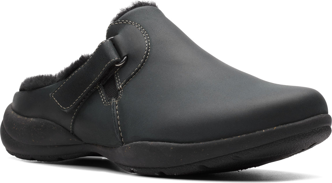 Black clog with adjustable strap and faux fur lining.