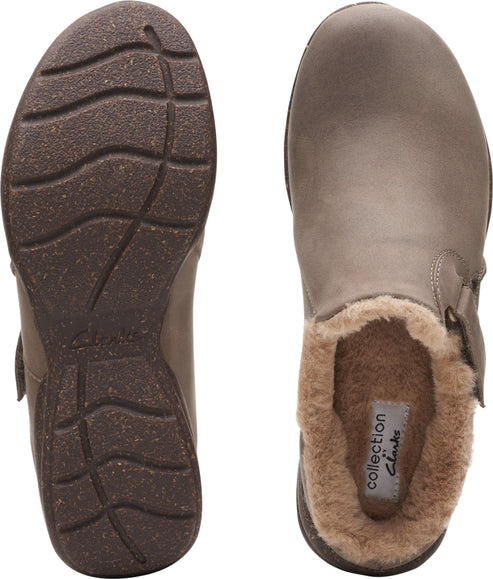 Two taupe-colored clogs, one showcasing the rubber sole and a velcro strap, and the other showing the faux fur lining.