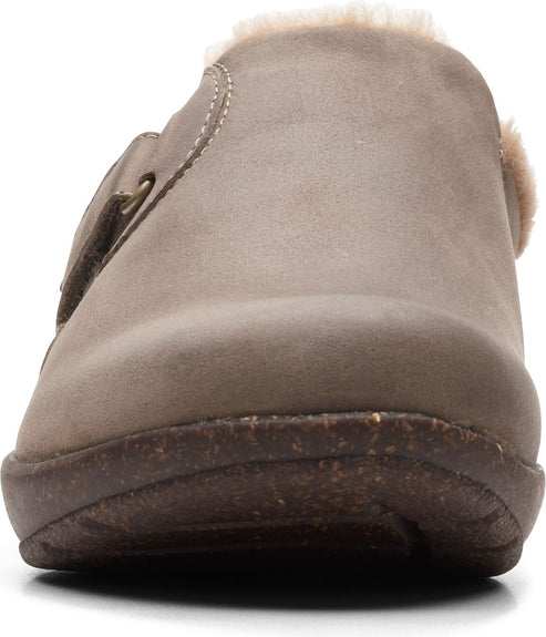 A taupe slip-on shoe with a hook and loop closure.