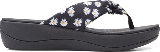A black platform sandal with a daisy print.
