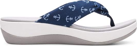 A navy blue flip-flop sandal with a white anchor pattern and white platform sole.