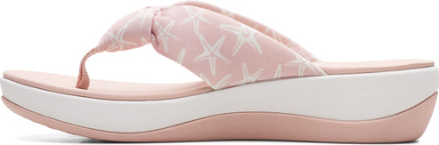 Pink platform sandal with starfish pattern.