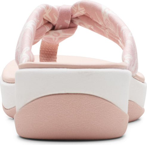 Rear view of pink platform flip-flops with knotted straps.