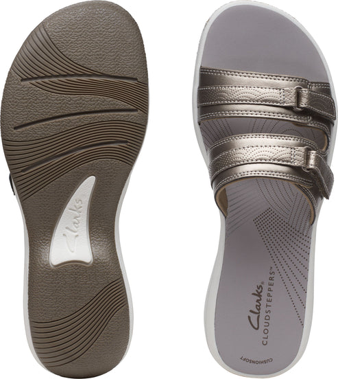 Sandal featuring two adjustable straps with buckles and 'Clarks CLOUDSTEPPERS' written on the insole.