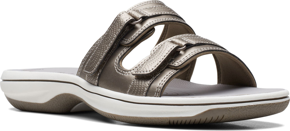 A pair of sandals with two straps and velcro closures.