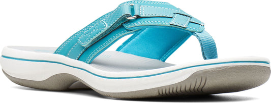 A blue sandal with a white and gray sole.