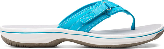A blue thong sandal has a white sole with a gray outsole.