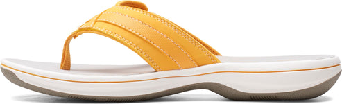 A yellow flip-flop sandal with a white sole.