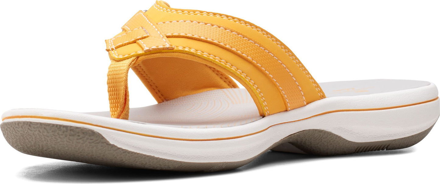 A yellow leather thong sandal with a white platform sole.