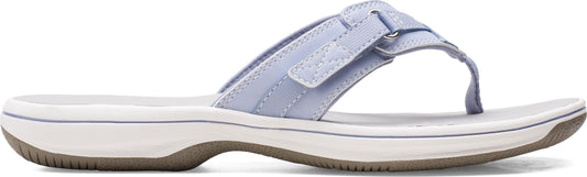 A light blue sandal with an adjustable strap and a white sole.