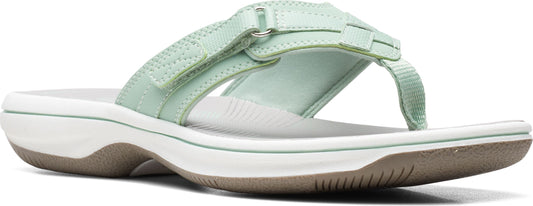 A mint sandal with adjustable straps.