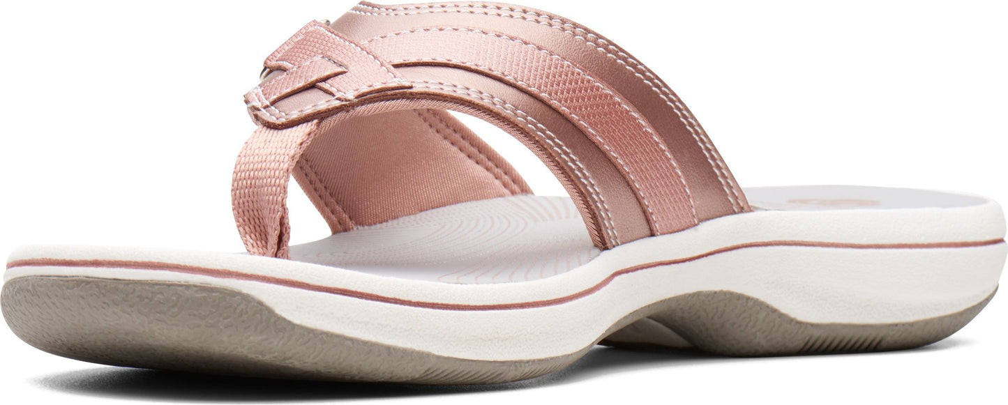 A rose gold flip-flop sandal.