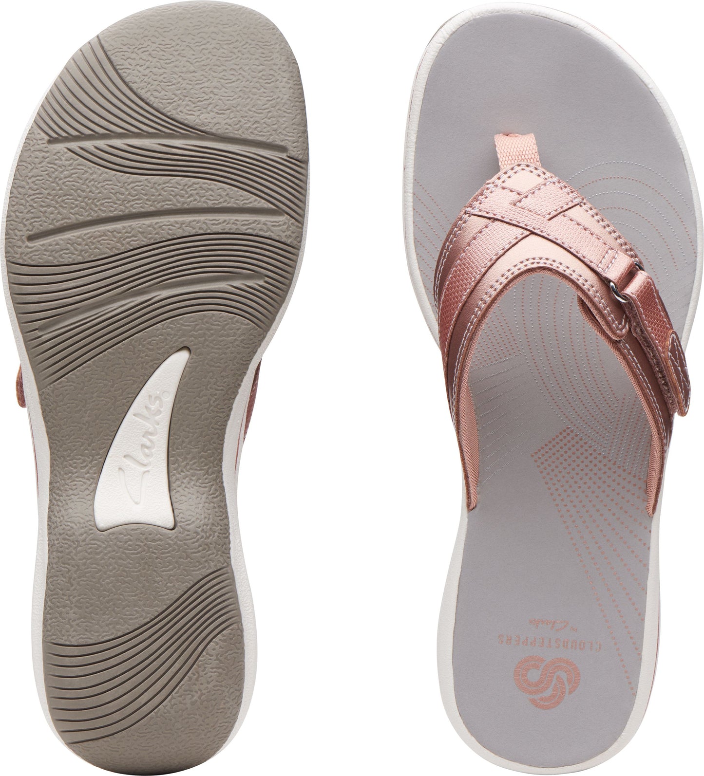 A pair of pink strappy flip-flops. The left shoe shows the ridged sole and the right shoe shows the insole.