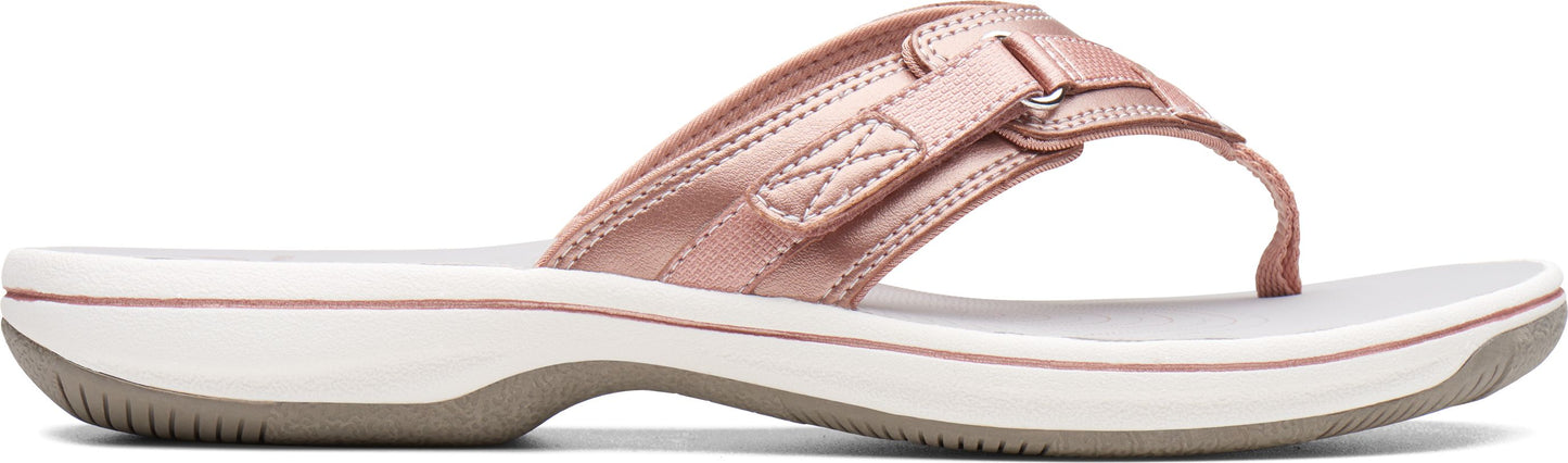 Rose-gold flip-flop sandal with a white sole.