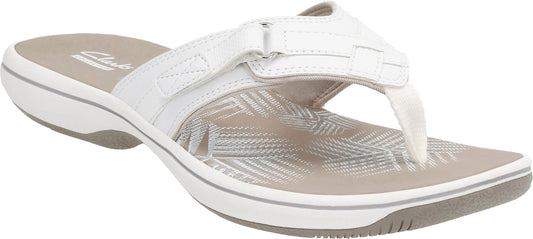 A white sandal with a toe post and adjustable strap.