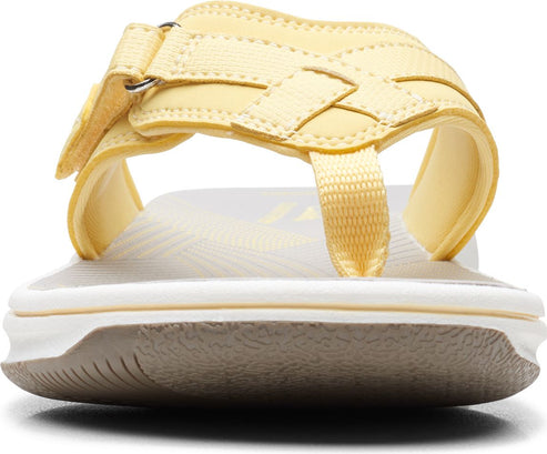 Yellow toe thong sandal with adjustable velcro strap.