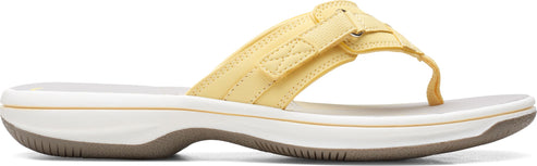 A yellow flip-flop sandal with a white sole.