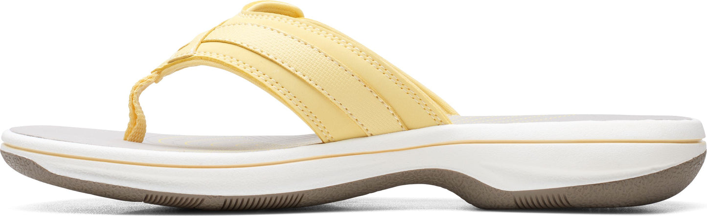 Yellow flip-flop sandal with a thick strap.