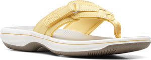 A yellow thong sandal with velcro straps.
