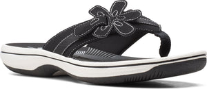 A black sandal with a flower.