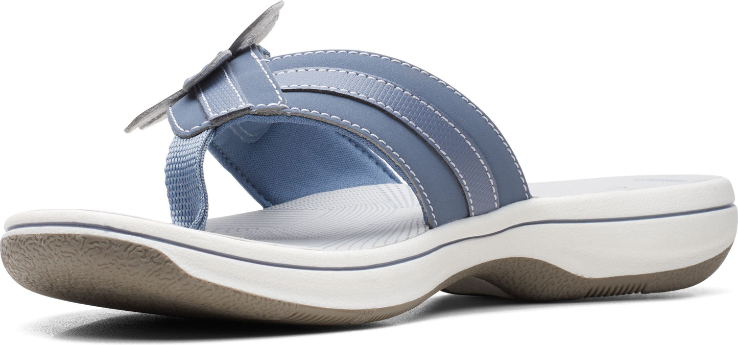 A blue sandal with a flower detail.