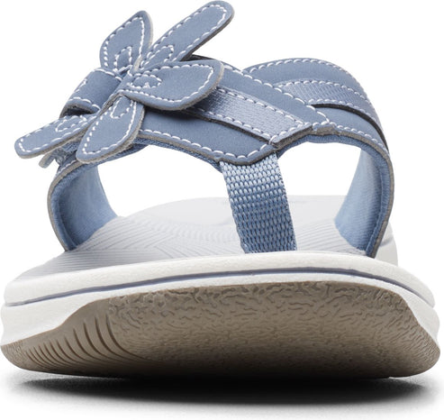 Light blue sandal with a flower design and toe post.