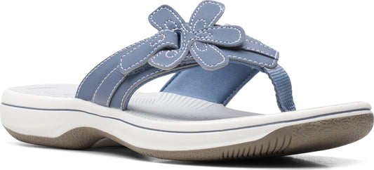 A light blue sandal with a floral detail.