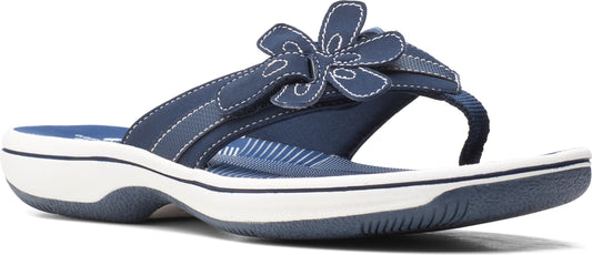 A blue sandal with a flower on the strap.