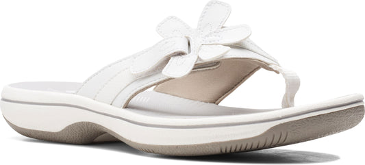 White sandal with a flower design.