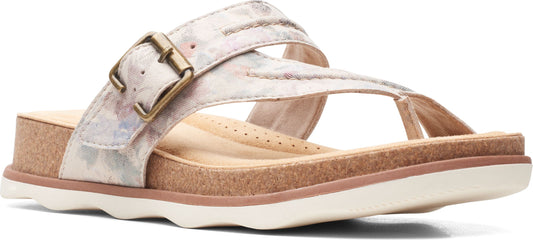 A sandal with floral patterned straps and buckle.