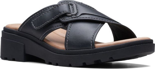 Black sandal with wide straps and buckle.