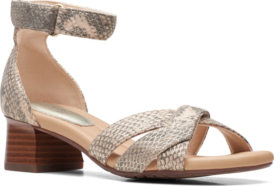 Snake-print sandal with toe straps and block heel.