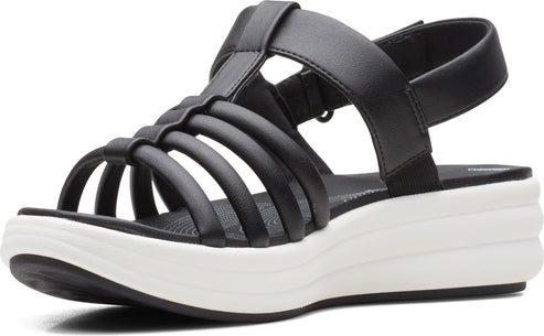 Black sandal with multiple straps across the foot, ankle strap, and a white platform sole.