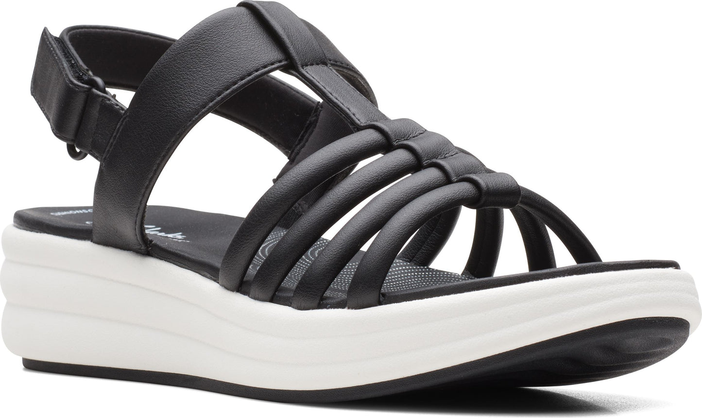 Black platform sandal with straps and adjustable velcro closure.