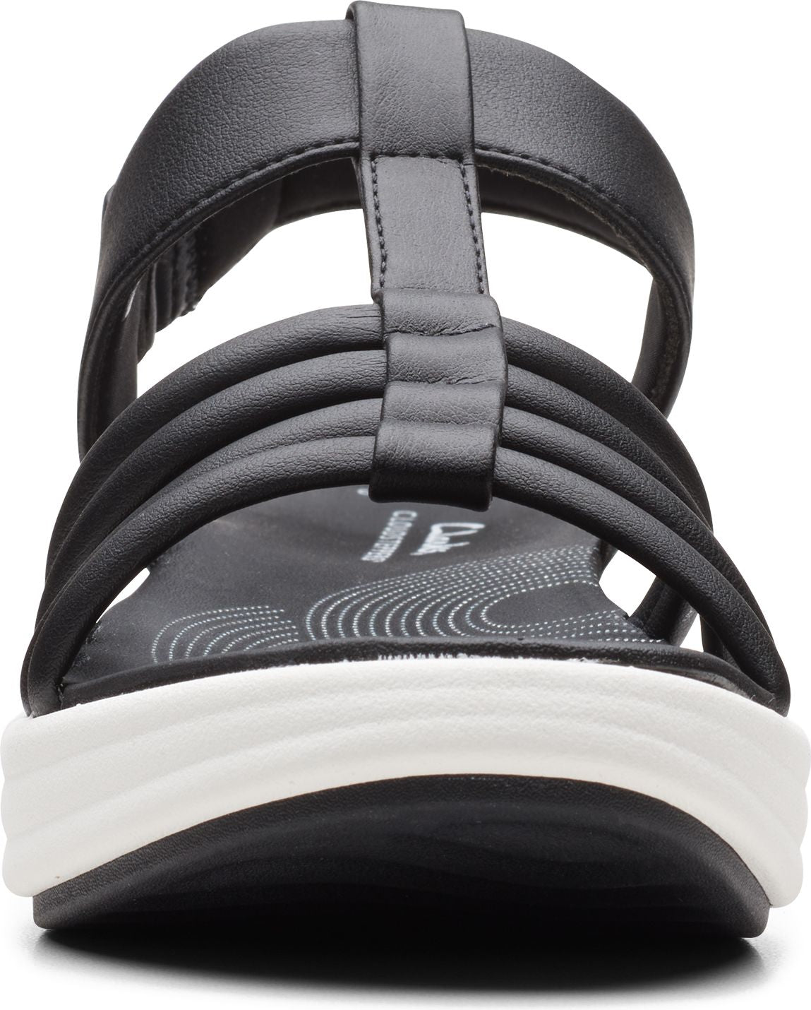Black t-strap sandal with layered straps and a white wedge sole.