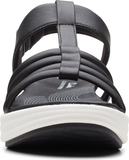 Black t-strap sandal with layered straps and a white wedge sole.
