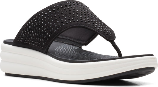Black thong sandal with studded top and white wedge sole.