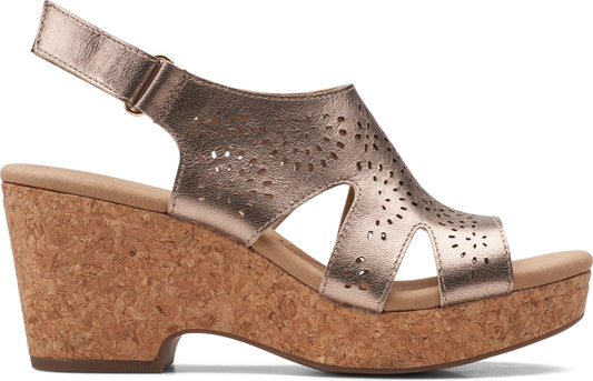 A gold, metallic sandal with an ankle strap and cork wedge.