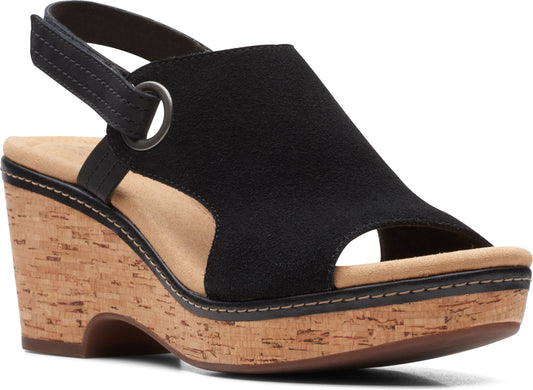 Black suede sandal with cork wedge and adjustable ankle strap.