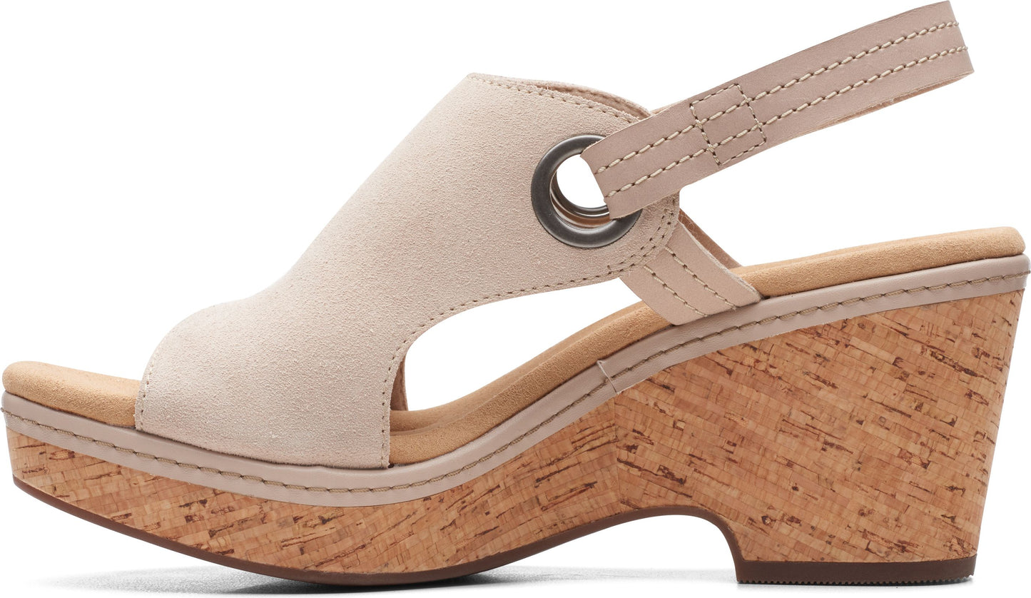 Wedge heel sandal with slingback strap and cork sole.