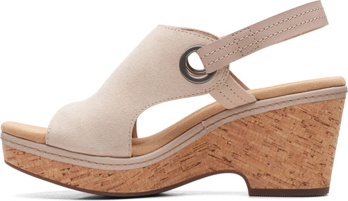 Wedge heel sandal with slingback strap and cork sole.
