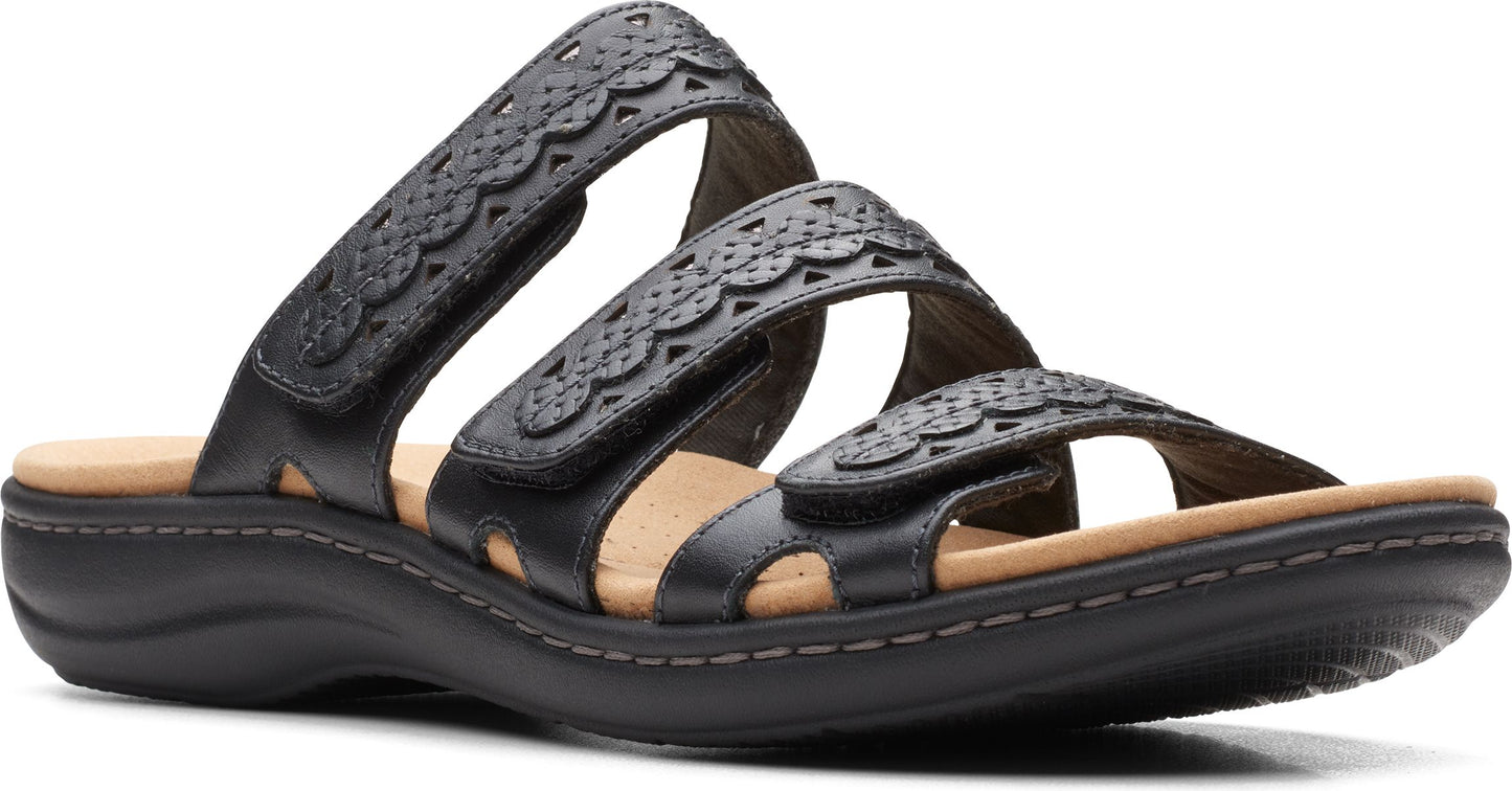 Black leather sandals with three adjustable straps featuring decorative cutouts.