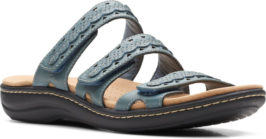 Blue sandal with velcro straps and decorative cutouts.
