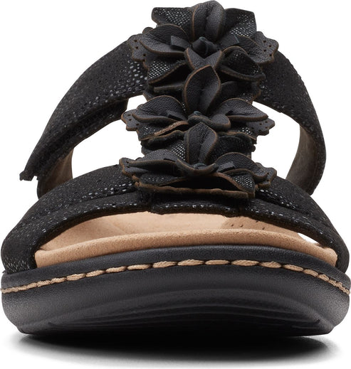 Black flower embellished sandal with a flat sole.