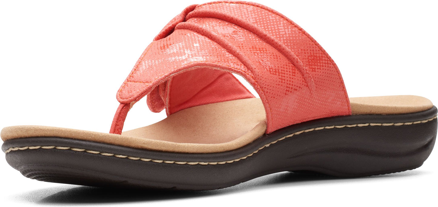 Coral sandal with gathered toe strap and low wedge heel.